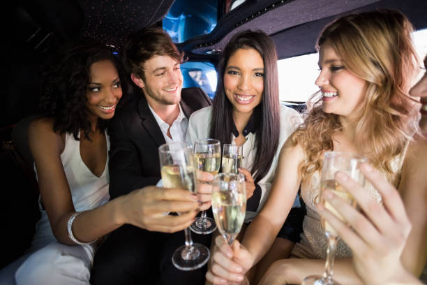 istock Happy friends drinking champagne 700560974