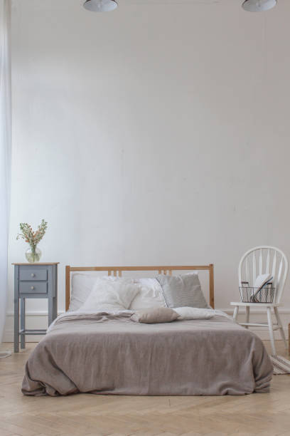 istock Interior of white and gray cozy bedroom 700578754