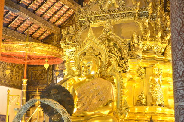 istock Golden Buddha statue in Thailand Buddha Temple. 700590292