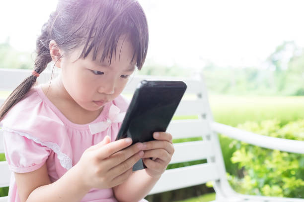 istock cute girl use phone 700590714