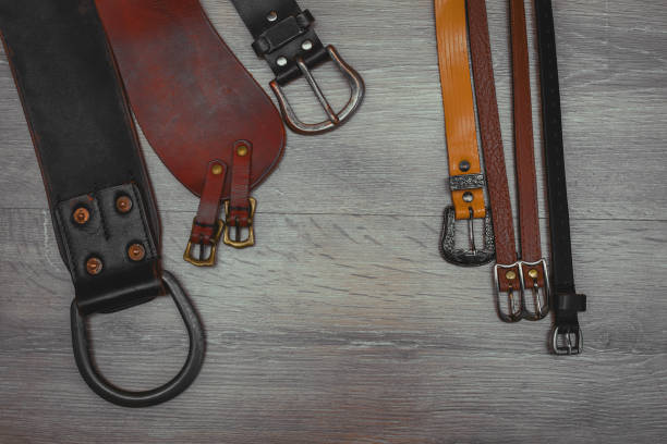 Fashionable leather belt and jeans top view.