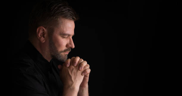 Praying Man stock photo
