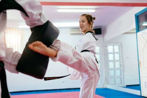 istock Girl with no arms on taekwondo training 700630214