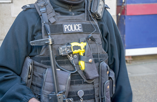 London policeman uniform and equipment. Includes taser gun, radios and fully automatic weapon