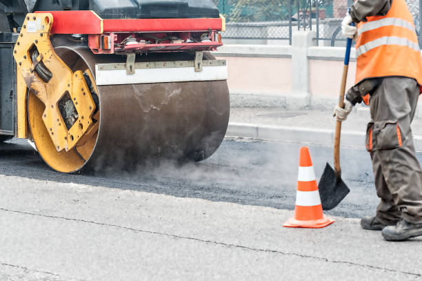 istock Heavy Vibration roller compactor at asphalt pavement works for road repairing 700637042
