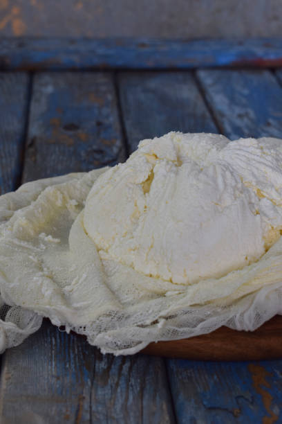 istock Cottage cheese from curdled milk or yoghurt on a wooden background 700641350