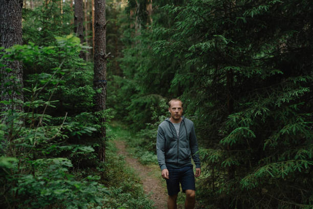 istock Man outdoors in Nature enjoying fresh air 700641840