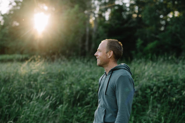 istock Man outdoors in Nature enjoying fresh air 700642126
