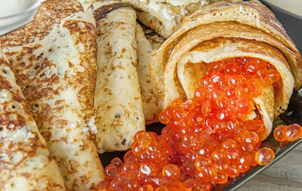 istock Delicious pancakes with caviar, salmon close up. The horizontal frame 700644808