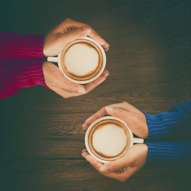 istock Young woman hand holding cup of mocca coffee 700653354