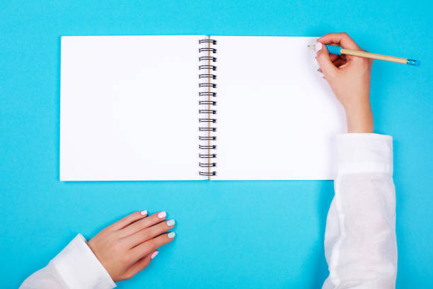 istock Spiral notepad with pencil as mockup for design 700654180