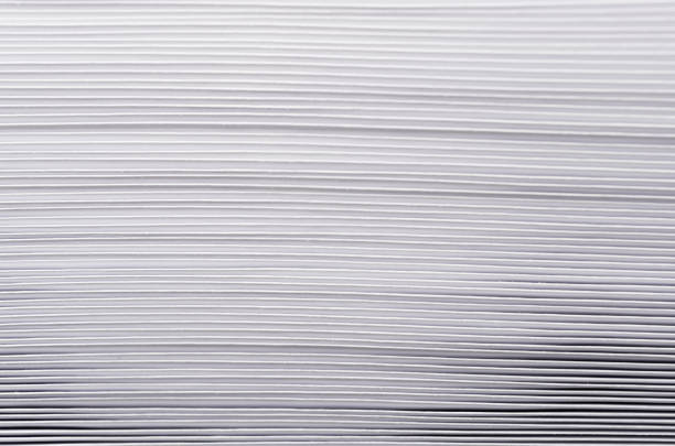 istock Striped rough white texture of pages paper with contrast gradient, abstract background. 700654474
