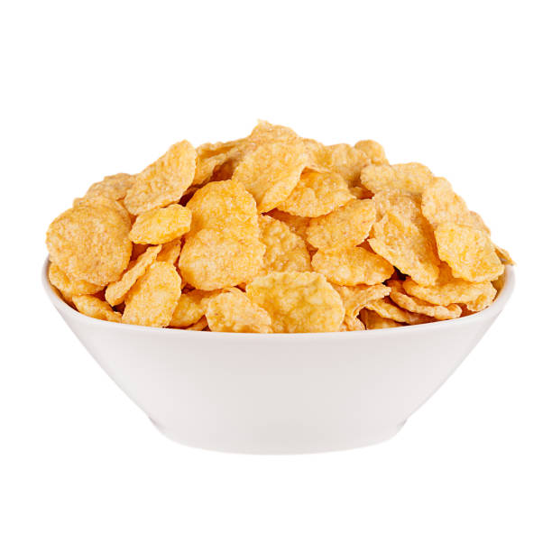istock Golden corn flakes in white bowl isolated on white backgriund. Cereals. 700654484