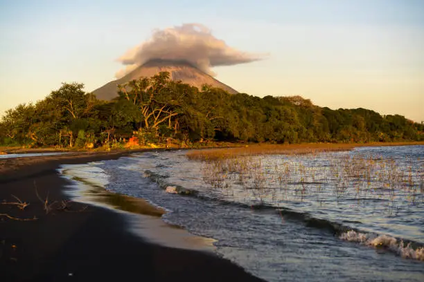 Jesus and Mary beach on island Ometepe in Lake Nicaragua with volcano Conception in background, Nicaragua in Central America. Volcano Conception is one of the most perfectly shaped volcanos of the Americas and the second highest, 1610 m in Nicaragua and is active volcano with last activity in March 2010.