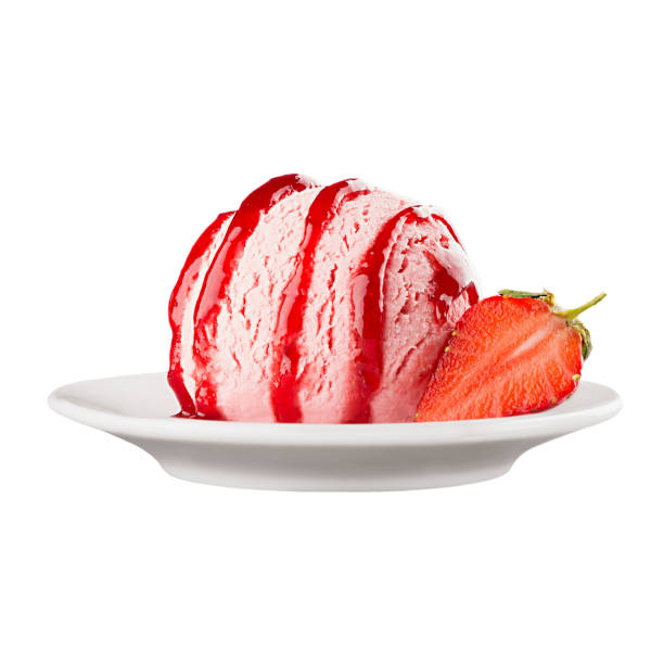 Ice cream pink scoop on plate decorated jam strips and slice strawberry, isolated on white background.