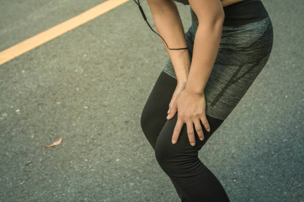 istock Young women accident knee pain over from running. 700661514