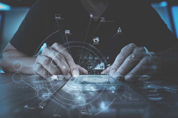 istock businessman hand working with modern computer in modern office with virtual icon diagram 700664764