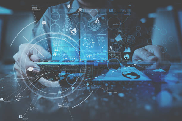 istock businessman hand working with modern computer in modern office with virtual icon diagram 700665188