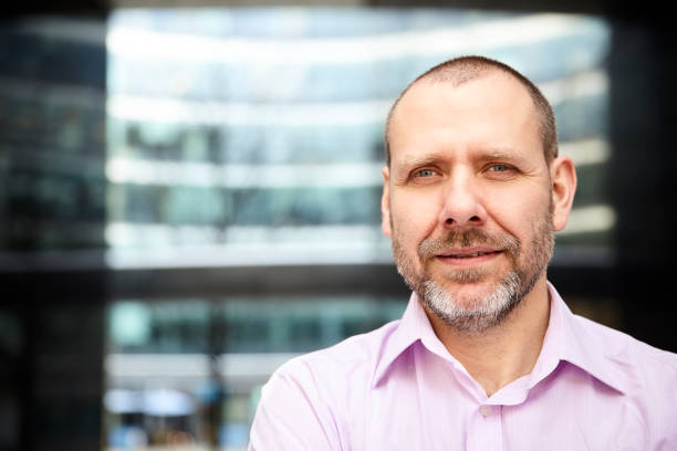 istock Pleasant man in pink shirt 700672708