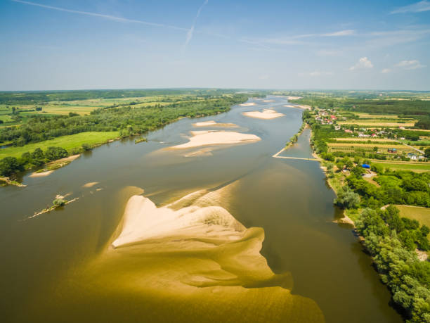 istock River seen from the bird's eye view. Vistula river with sandy shoals. 700673022
