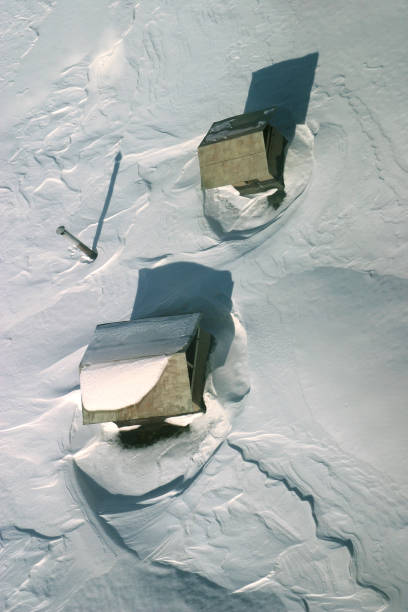 istock roof covered with snow. The top view 700673028