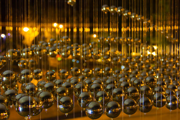 Abstract background with many hanging metal balls