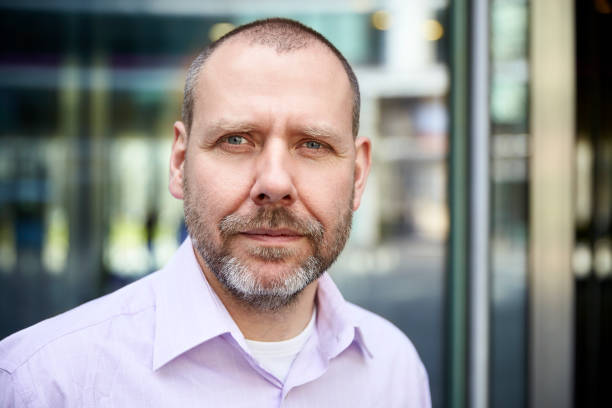 istock Headshot of mature man 700685418
