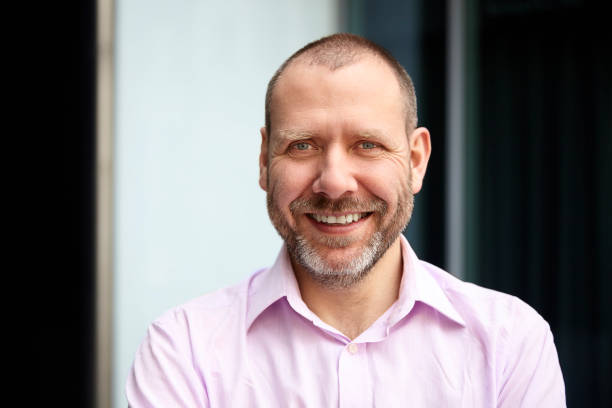 istock Portrait of cheerful middle-aged man 700685838