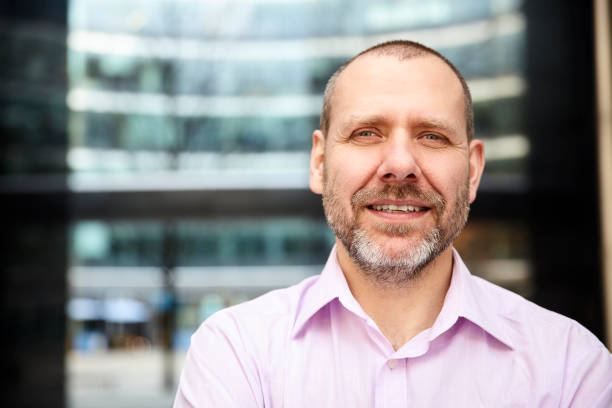 istock Pleasant man in pink shirt 700685958