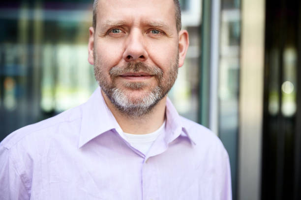 istock Headshot of mature man 700688804