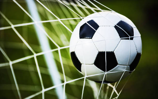 istock Soccer ball in goal 700692152