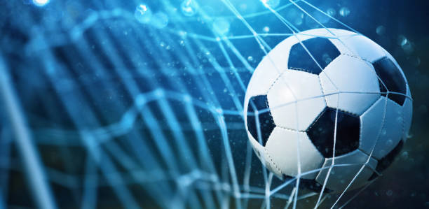 istock Soccer ball in goal 700692228