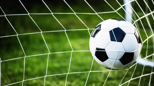 istock Soccer ball in goal 700692264