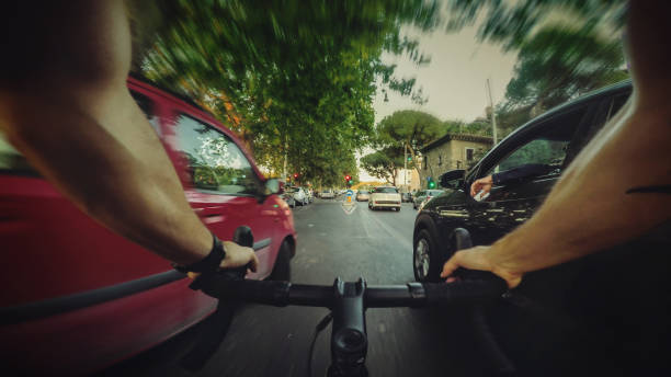 istock POV commuter riding a road racing bicycle in the traffic 700697746