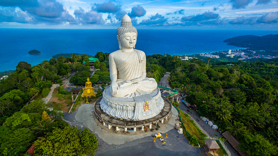 aerial photography white great Phuket’s big Buddha in blue sky. Phuket's Big Buddha is one of the island's most important and revered landmarks on the island.
