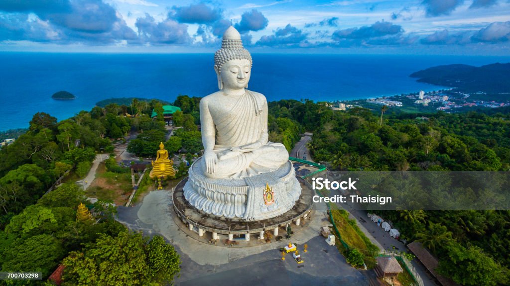 aerial photography white great Phuket’s big Buddha in blue sky. aerial photography white great Phuket’s big Buddha in blue sky. Phuket's Big Buddha is one of the island's most important and revered landmarks on the island. Phuket Island Stock Photo