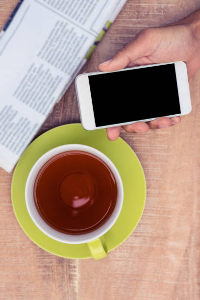 istock Cropped image of man holding smart phone 700719106