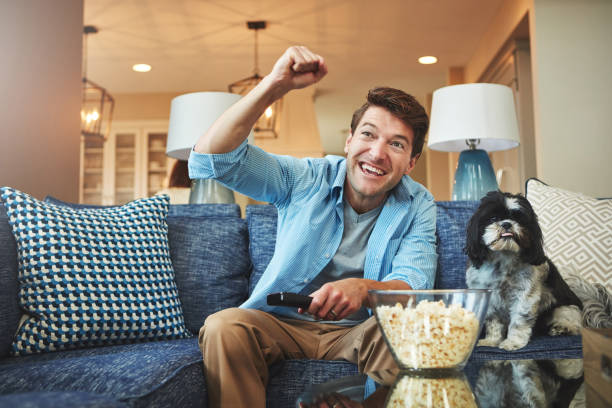 istock Sofa, snacks, sports. The ultimate fan combo 700721534