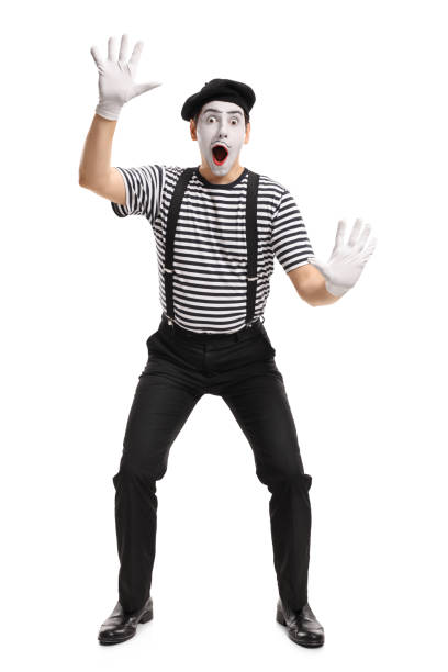 Mime holding his hands on an invisible wall Full length portrait of a mime holding his hands on an invisible wall isolated on white background mime artist stock pictures, royalty-free photos & images