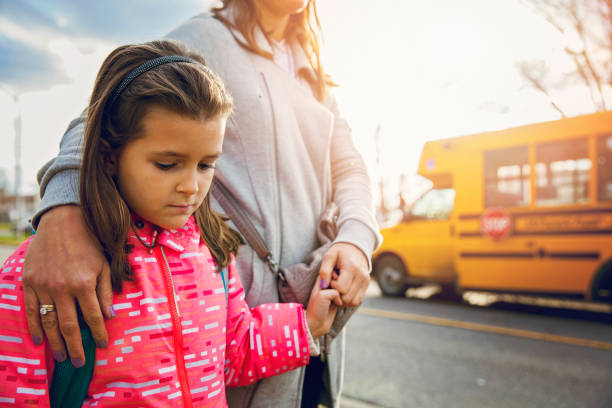 istock Mother Seeing Her Daughter Off to School 700729632