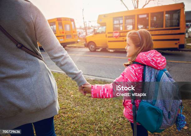 Mother Seeing Her Daughter Off To School Stock Photo - Download Image Now - School Bus, Waiting, Parent