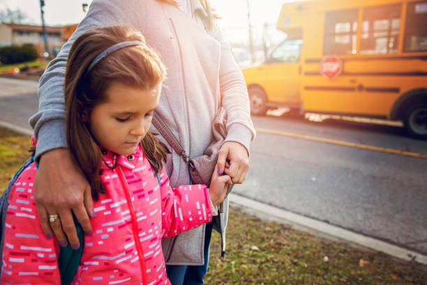 istock Mother Seeing Her Daughter Off to School 700729644