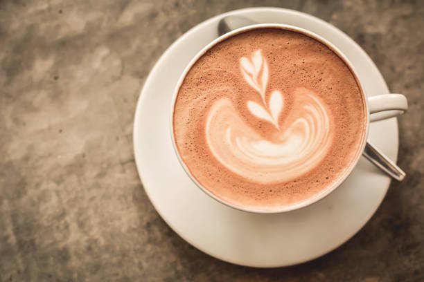 istock Close-Up Of Cappuccino On Table 700741255