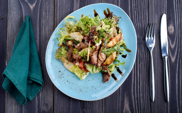 istock Veal medallions with apple, pear and cheese 700742434