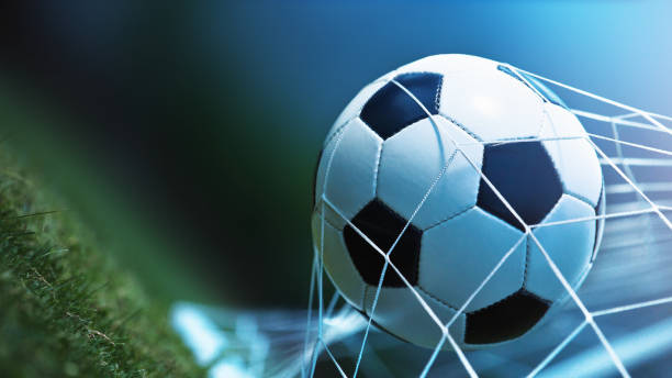 istock Soccer ball in goal 700749756