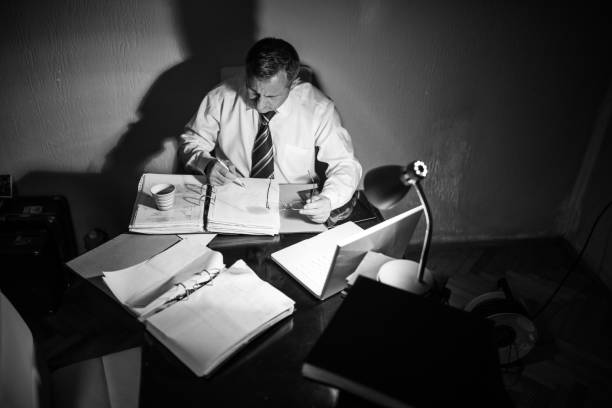 istock Busy night at the firm 700750894