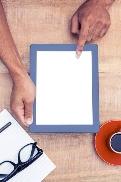 istock Overhead view of person using on digital tablet 700763840