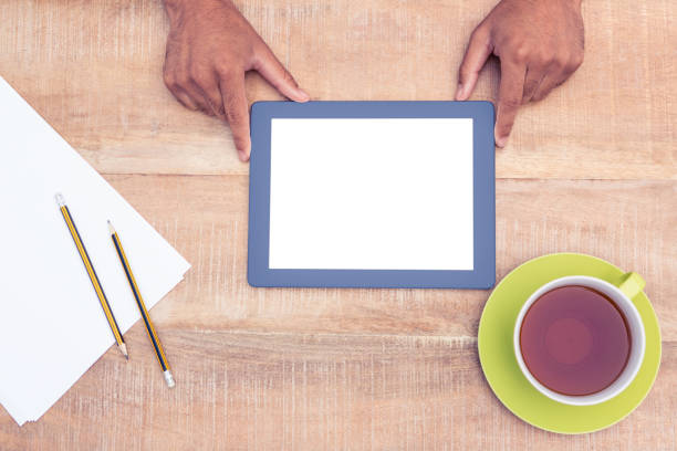 istock Cropped image of man with digital tablet over table 700764422