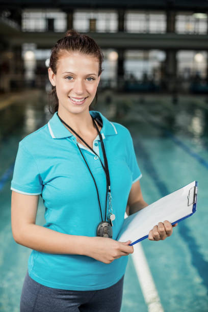 istock Trainer woman holding a clipboard 700764556