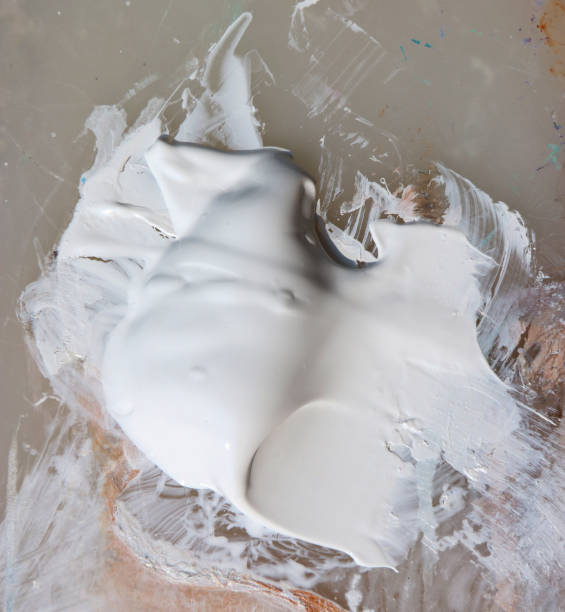 istock White pigment acrylic colors on palette. 700768240